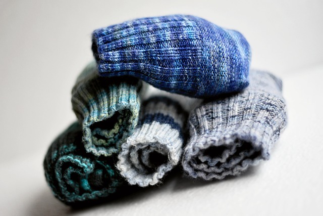 hands knitting socks yarn